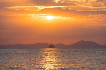Golden sunset over sea horizon