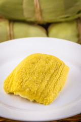 pamonha, Brazilian sweet made from homemade cheese with corn. Open pissing ready for consumption. Concept of traditional Brazilian sweet, typical food of the months of June and July.