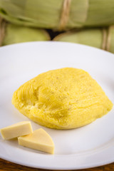pamonha, Brazilian sweet made from homemade cheese with corn. Open pissing ready for consumption. Concept of traditional Brazilian sweet, typical food of the months of June and July.