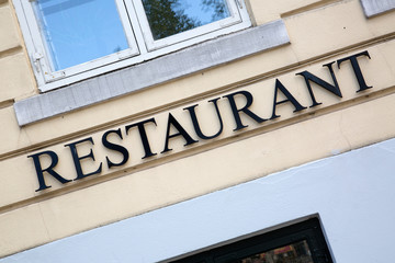 Restaurant Sign on Building