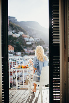 girl sits on chairs