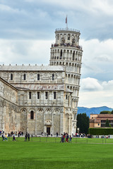 a historic cathedral in the Romanesque style and the Leaning Tower of Pisa, Italy.