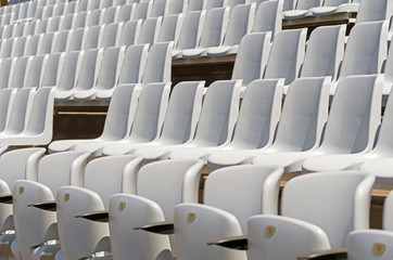 Empty stands with seats in the stadium