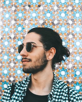 man wearing black and white checked collared shirt