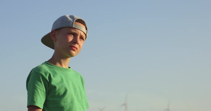 Boy standing in sunshine