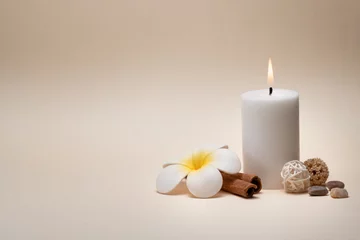 Foto op Canvas Beautiful spa composition with candle, frangipani flower and other decor elements. © gudenkoa