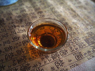 Tea cup on Chinese script