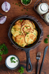 Fried potato fritters in a pan. Draniki - the national dish of Belarus, Ukraine and Russia.