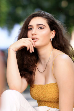 woman in brown sleeveless to
