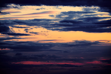 Beautiful sunset - dark sky with clouds and sunlight
