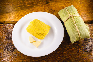 pamonha, Brazilian sweet made from homemade cheese with corn. Open pissing ready for consumption....