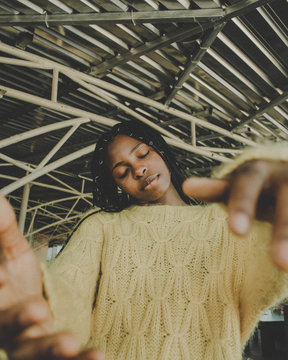 woman wearing brown sweater