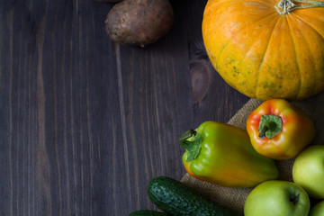 pumpkin and vegetables on wooden table
