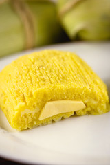 pamonha, Brazilian sweet made from homemade cheese with corn. Open pissing ready for consumption. Concept of traditional Brazilian sweet, typical food of the months of June and July.