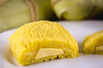 pamonha, Brazilian sweet made from homemade cheese with corn. Open pissing ready for consumption. Concept of traditional Brazilian sweet, typical food of the months of June and July.