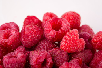 Raspberry berries red tasty sweet bright texture pattern on white background copy space macro