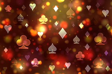 Dark bright pattern of playing card symbols.