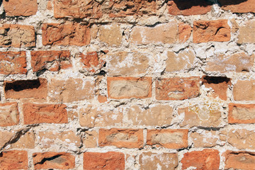 Red weathered brick wall, old ruined building
