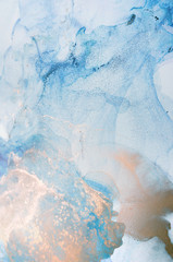 The picture is painted in alcohol ink. Abstraction will perfectly fit into a modern interior. Closeup of the painting. Colorful abstract painting background.