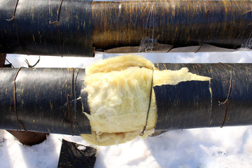 Yellow insulation material around the pipe with hot tap water.