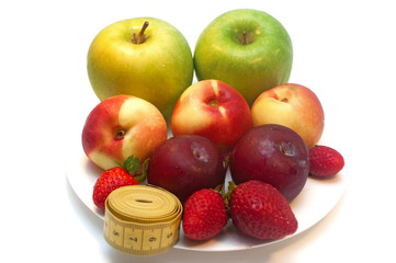 Fresh fruits in a plate isolated on white background
