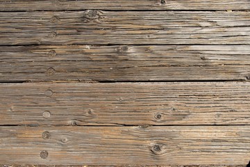 Naklejka premium wooden boards forming a rustic floor.
