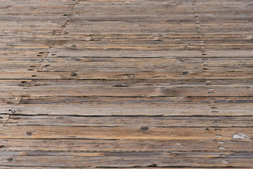 Naklejka premium wooden boards forming a rustic floor.