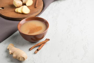 Tea masala in a Cup with the winter spices of cinnamon and ginger