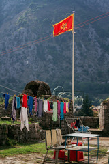 Authentic Montenegro courtyard in Kotor with drying clothes.