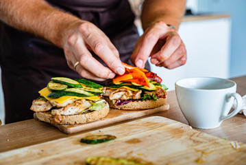 man making burger on the kitchen