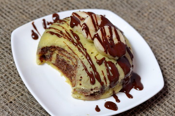 Coarse linen fabric. It has a plate with a banana magcake.