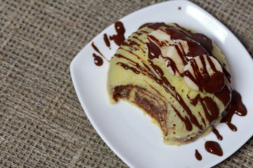 Coarse linen fabric. It has a plate with a banana magcake.