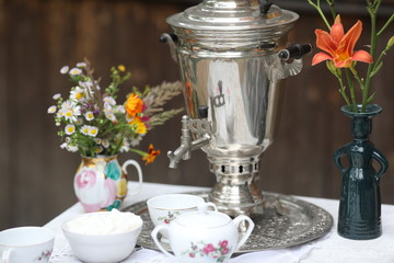 Russian tea ceremony with samovar and sweets and fruits