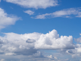 white clouds against a blue sky, abstract illustration