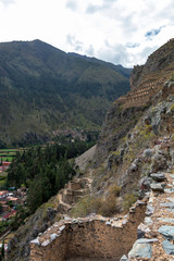 Fototapeta na wymiar Ollantaytambo ruins, a massive Inca fortress with large stone terraces on a hillside, tourist destination in Peru