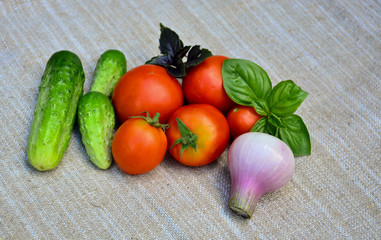 Fresh vegetables. Tomatoes, cucumbers, basil, onion