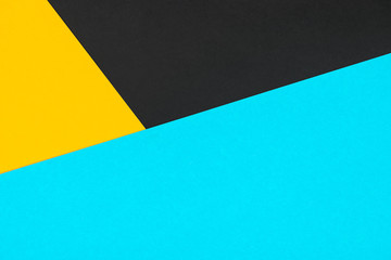 Yellow black blue colored paper background