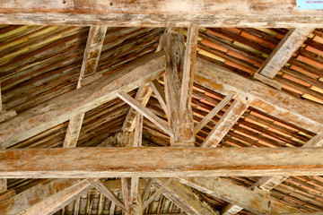 traditional wooden roof framework seen from below