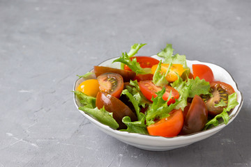 Snack from tomato and salad.