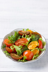 Snack from tomato and salad.