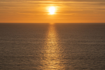 Fototapeta premium Etretat, France - 05 31 2019: sunset over the sea of Etretat