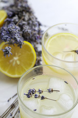 Tasty and fresh lavender lemonade on light background