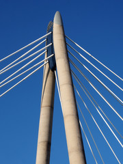the concrete tower and cables of the suspension bridge in southport merseyside against a blue sky