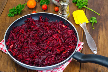 Dietary dishes. Stewed beet in frying pan