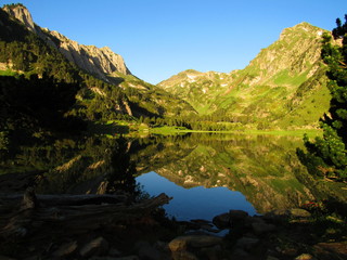 Fototapeta na wymiar Sunrise on lake in mountains
