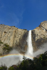 A rainbow at the base of Bridal Veil Falls in Yosemite Valley, Yosemite National Park, California in spring
