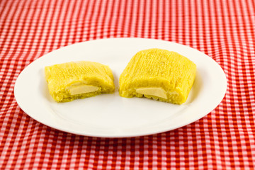 Pamonha, Brazilian sweet corn with cheese filling. Pamonha typical of Brazil, food of the state of minas gerais and goiais. Concept of traditional food. Brazilian food at rural parties