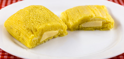 Pamonha, Brazilian sweet corn with cheese filling. Pamonha typical of Brazil, food of the state of minas gerais and goiais. Concept of traditional food. Brazilian food