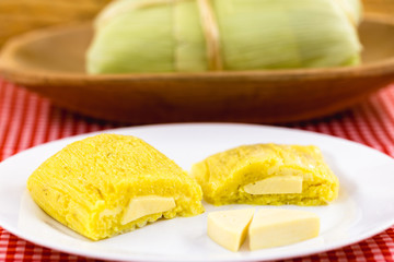 Pamonha, Brazilian sweet corn with cheese filling. Pamonha typical of Brazil, food of the state of minas gerais and goiais. Concept of traditional food. Brazilian food