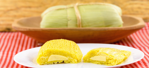 Pamonha, Brazilian sweet corn with cheese filling. Pamonha typical of Brazil, food of the state of minas gerais and goiais. Concept of traditional food. Brazilian food